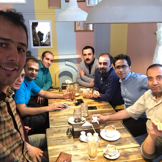 KurdSoftware community members gathered around a café table.